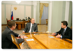 Prime Minister Vladimir Putin in a working meeting with Alexander Medvedev, Gazprom Deputy Chairman of the Board and President of the Continental Hockey League (KHL), and Vyacheslav Bykov, Head Coach of the Russian national hockey team