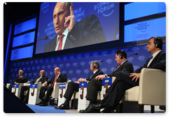 Prime Minister Vladimir Putin answers questions from the audience at the opening plenary meeting of the Davos forum