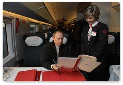 Prime Minister Vladimir Putin returned to Moscow from his trip to St Petersburg on a new high-speed train Sapsan