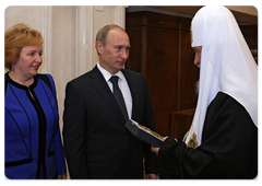 Prime Minister Vladimir Putin with wife Lyudmila arrived at Moscow's Christ the Saviour Cathedral to personally congratulate Russian Orthodox Patriarch Kirill on his Name Day|24 may, 2009|17:27