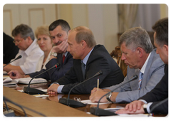 Prime Minister Vladimir Putin with members of the editorial board of Soviet Sport newspaper on its 85th anniversary|20 july, 2009|19:14