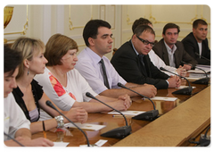 Prime Minister Vladimir Putin with members of the editorial board of Soviet Sport newspaper on its 85th anniversary|20 july, 2009|19:20