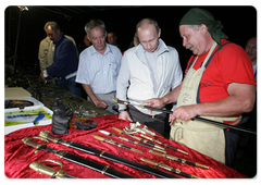 Prime Minister Vladimir Putin visited the ethnographic village of Taltsy on the banks of the Angara River, where he viewed handmade iron crafts by Lake Baikal area’s blacksmiths|2 august, 2009|11:02