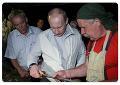 Prime Minister Vladimir Putin visited the ethnographic village of Taltsy on the banks of the Angara River, where he viewed handmade iron crafts by Lake Baikal area’s blacksmiths|2 august, 2009|11:03