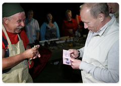 Prime Minister Vladimir Putin visited the ethnographic village of Taltsy on the banks of the Angara River, where he viewed handmade iron crafts by Lake Baikal area’s blacksmiths|2 august, 2009|11:04