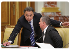 Vitaly Mutko, Minister for Sports, Tourism, and Youth Policy, left, and Deputy Prime Minister Igor Sechin at a Government meeting|15 september, 2009|16:43