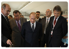 Russian Prime Minister Vladimir Putin visiting an exhibition of development plans for the constituent entities of the Russian Federation as part of his participation in the Sochi International Investment Forum|18 september, 2009|15:50