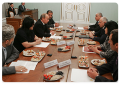 Prime Minister Vladimir Putin with leaders of Dagestan and local militia veterans ten years after international terrorists attacked the North Caucasus republic|25 september, 2009|11:26