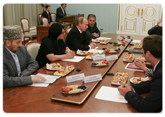 Prime Minister Vladimir Putin with leaders of Dagestan and local militia veterans ten years after international terrorists attacked the North Caucasus republic|25 september, 2009|11:42