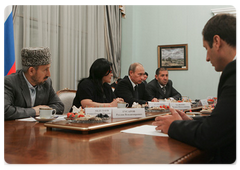 Prime Minister Vladimir Putin with leaders of Dagestan and local militia veterans ten years after international terrorists attacked the North Caucasus republic|25 september, 2009|11:45