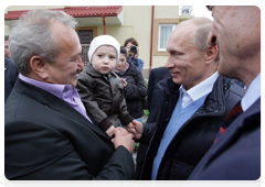 Prime Minister Vladimir Putin in the village of Nekrasovskoye, near Sochi, where people are being rehoused who have been displaced from the Imereti Valley to make way for the 2014 Olympic facilities|13 october, 2010|17:49