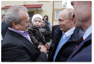 Vladimir Putin visits the village of Nekrasovskoye, near Sochi, where people are being rehoused who have been displaced from the Imereti Valley to make way for the 2014 Olympic facilities