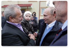 Vladimir Putin visits the village of Nekrasovskoye, near Sochi, where people are being rehoused who have been displaced from the Imereti Valley to make way for the 2014 Olympic facilities