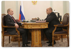 Prime Minister Vladimir Putin meets with head of the Federal Taxation Service Mikhail Mishustin