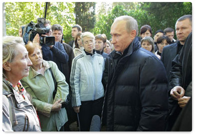 Prime Minister Vladimir Putin visits the flood-hit town of Novomikhailovsky in the Krasnodar Territory and talks to locals