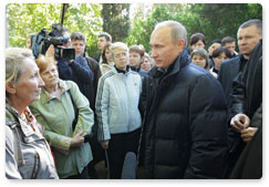 Prime Minister Vladimir Putin visits the flood-hit town of Novomikhailovsky in the Krasnodar Territory and talks to locals