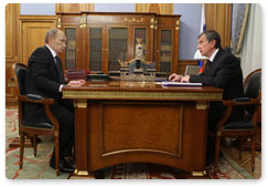 Prime Minister Vladimir Putin meets with his deputy Igor Sechin