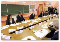 Prime Minister Vladimir Putin meets with the teachers and parents in the Secondary School 1066