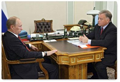 Prime Minister Vladimir Putin at a meeting with CEO of the Russian Railways Vladimir Yakunin