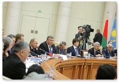 Prime Minister Vladimir Putin takes parts in an extended attendance meeting of the EurAsEC Interstate Council