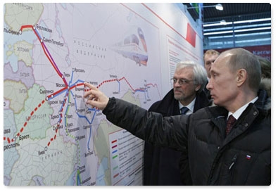 Prime Minister Vladimir Putin and Finnish President Tarja Halonen arrive in St Petersburg on the new Allegro high-speed train