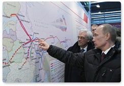 Prime Minister Vladimir Putin and Finnish President Tarja Halonen arrive in St Petersburg on the new Allegro high-speed train