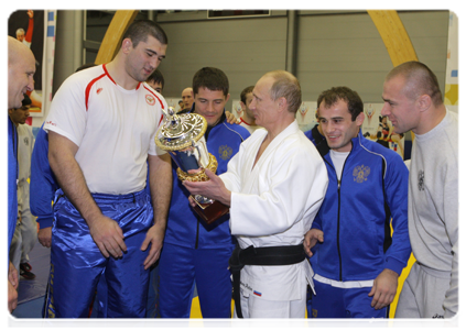 Prime Minister Putin talking with the Russian wrestling team after their training session|22 december, 2010|22:39