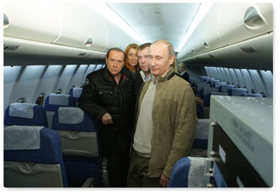President Dmitry Medvedev, Prime Minister Vladimir Putin, and Italian Prime Minister Silvio Berlusconi tour the new Sukhoi Superjet 100 Russian mid-range aircraft