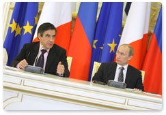 Russian Prime Minister Vladimir Putin and French Prime Minister Francois Fillon hold a joint news conference after the 15th session of the Russian-French commission on bilateral cooperation