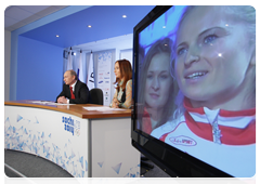 Prime Minister Vladimir Putin speaking with the Russian Olympic team at the Russian House in Vancouver during a video conference at the Olympic Information Centre, Sochi 2014|11 february, 2010|22:26