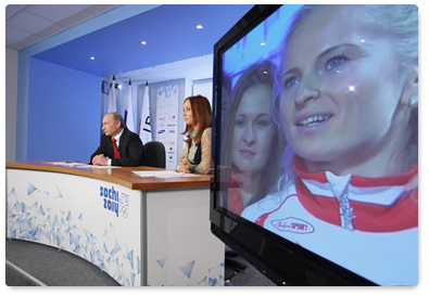 Prime Minister Vladimir Putin holds a video conference at the Olympic Information Centre, Sochi 2014, to speak with the Russian Olympic team at the Russian House in Vancouver