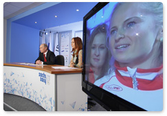 Prime Minister Vladimir Putin holds a video conference at the Olympic Information Centre, Sochi 2014, to speak with the Russian Olympic team at the Russian House in Vancouver