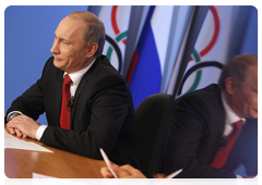 Prime Minister Vladimir Putin speaking with the Russian Olympic team at the Russian House in Vancouver during a video conference at the Olympic Information Centre, Sochi 2014|11 february, 2010|22:26