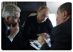 Prime Minister Vladimir Putin, Deputy Prime Minister Igor Sechin and Chief of the Government Executive Office Sergei Sobyanin in a helicopter flying to the Sayano-Shushenskaya Hydroelectric Power Plant|24 february, 2010|09:46