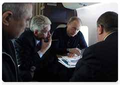 Prime Minister Vladimir Putin, Deputy Prime Minister Igor Sechin and Chief of the Government Executive Office Sergei Sobyanin in a helicopter flying to the Sayano-Shushenskaya Hydroelectric Power Plant|24 february, 2010|09:46