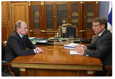 Prime Minister Vladimir Putin meets with Sberbank Chairman German Gref