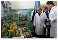 Prime Minister Vladimir Putin visits one of northwestern Russia’s largest fish processing plants during a working trip to the Murmansk Region