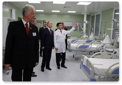 Prime Minister Vladimir Putin tours the new surgical building at the Alexandro-Mariinskaya regional hospital in Astrakhan