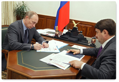 Prime Minister Vladimir Putin meets with Minister of Transport Igor Levitin