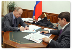 Prime Minister Vladimir Putin meets with Minister of Transport Igor Levitin