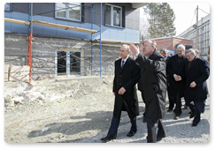 Prime Minister Vladimir Putin inspects construction of a hostel in Novosibirsk’s Akademgorodok during his visit to the Siberian Federal District