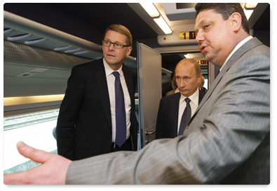 Russian Prime Minister Vladimir Putin and Finnish Prime Minister Matti Vanhanen attend the presentation of the high-speed Allegro train in Finland