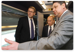 Russian Prime Minister Vladimir Putin and Finnish Prime Minister Matti Vanhanen attend the presentation of the high-speed Allegro train in Finland