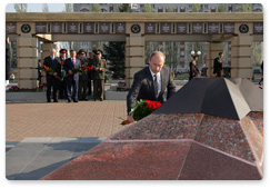 Prime Minister Vladimir Putin lays flowers at the Eternal Flame under the Colonnade of the Memorial to Glory in Kazan