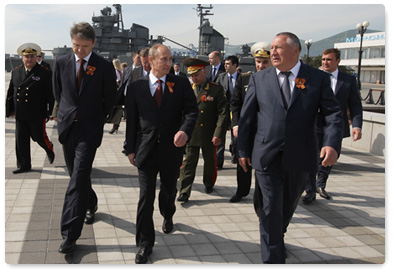 After visiting the construction headquarters at the Voyennaya Gavan naval base in Novorossiysk, Prime Minister Vladimir Putin travels by seagoing tugboat to the Admiral Serebryakov Embankment