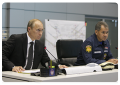 Prime Minister Vladimir Putin and Minister of Civil Defence, Emergencies, and Disaster Relief Sergei Shoigu at a videoconference in the Situations Room of the Ministry of Civil Defence, Emergencies and Disaster Relief to discuss the recent accident at the Raspadskaya coal mine in the Kemerovo Region|9 may, 2010|12:08