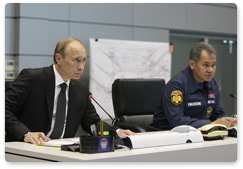 Prime Minister Vladimir Putin holds a videoconference in the Situations Room of the Ministry of Civil Defence, Emergencies and Disaster Relief to discuss the recent accident at the Raspadskaya coal mine in the Kemerovo Region