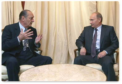 Prime Minister Vladimir Putin meets with former French President Jacques Chirac during a working visit to France