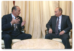Prime Minister Vladimir Putin meets with former French President Jacques Chirac during a working visit to France