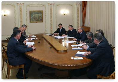 Prime Minister Vladimir Putin meets with Chevron Chairman and CEO John Watson